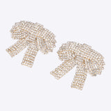 Aretes moños maxi brillos
