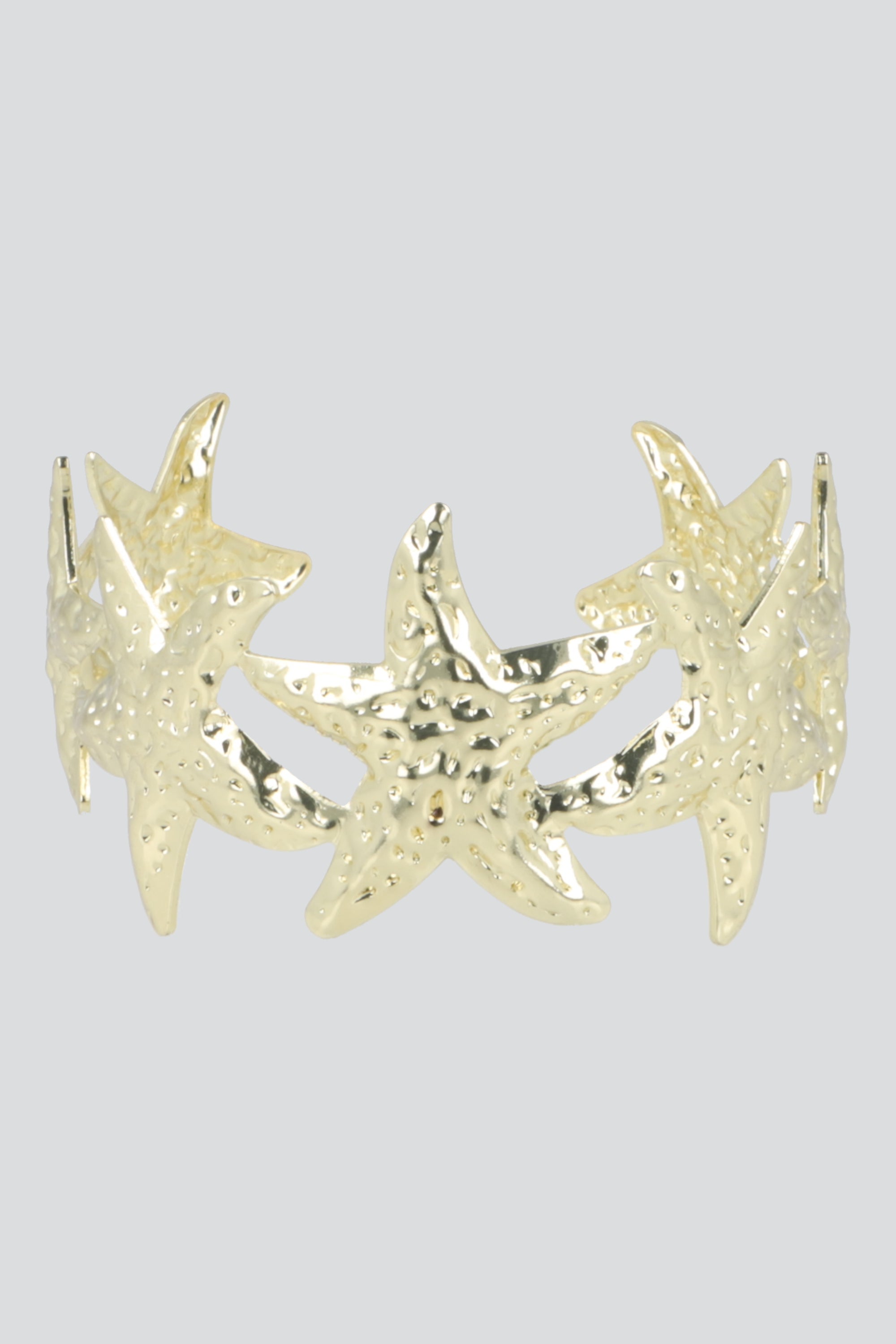 CUFF MULTI ESTRELLAS MAR METAL ORO