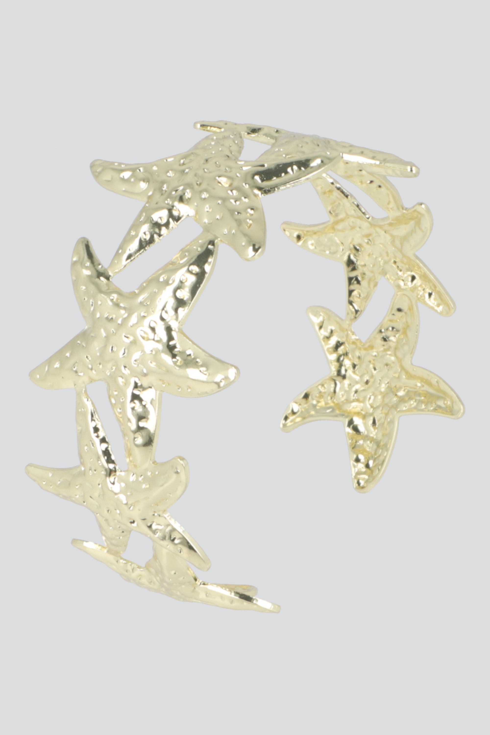 CUFF MULTI ESTRELLAS MAR METAL ORO