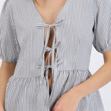 Blusa manga corta detalle moños