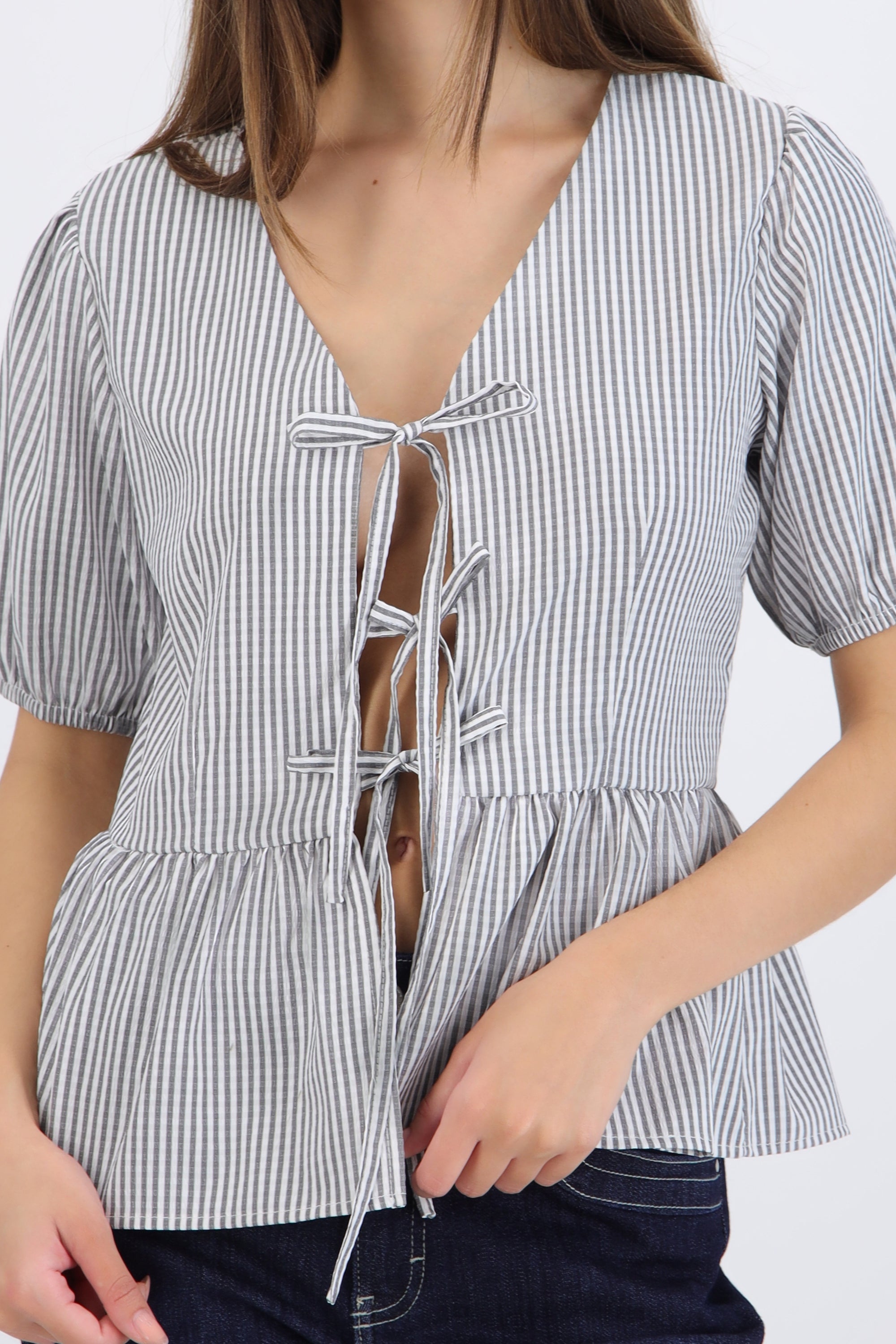 Blusa manga corta detalle moños