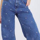 Jeans wide leg estrellas bordadas