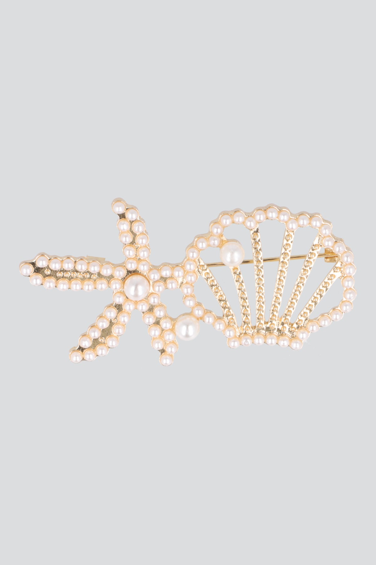 Broche estrella concha mar ORO