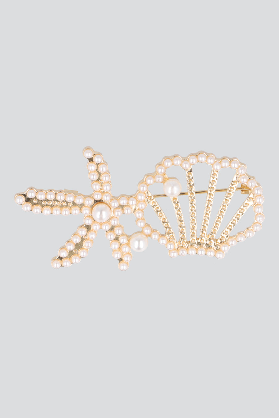 Broche estrella concha mar