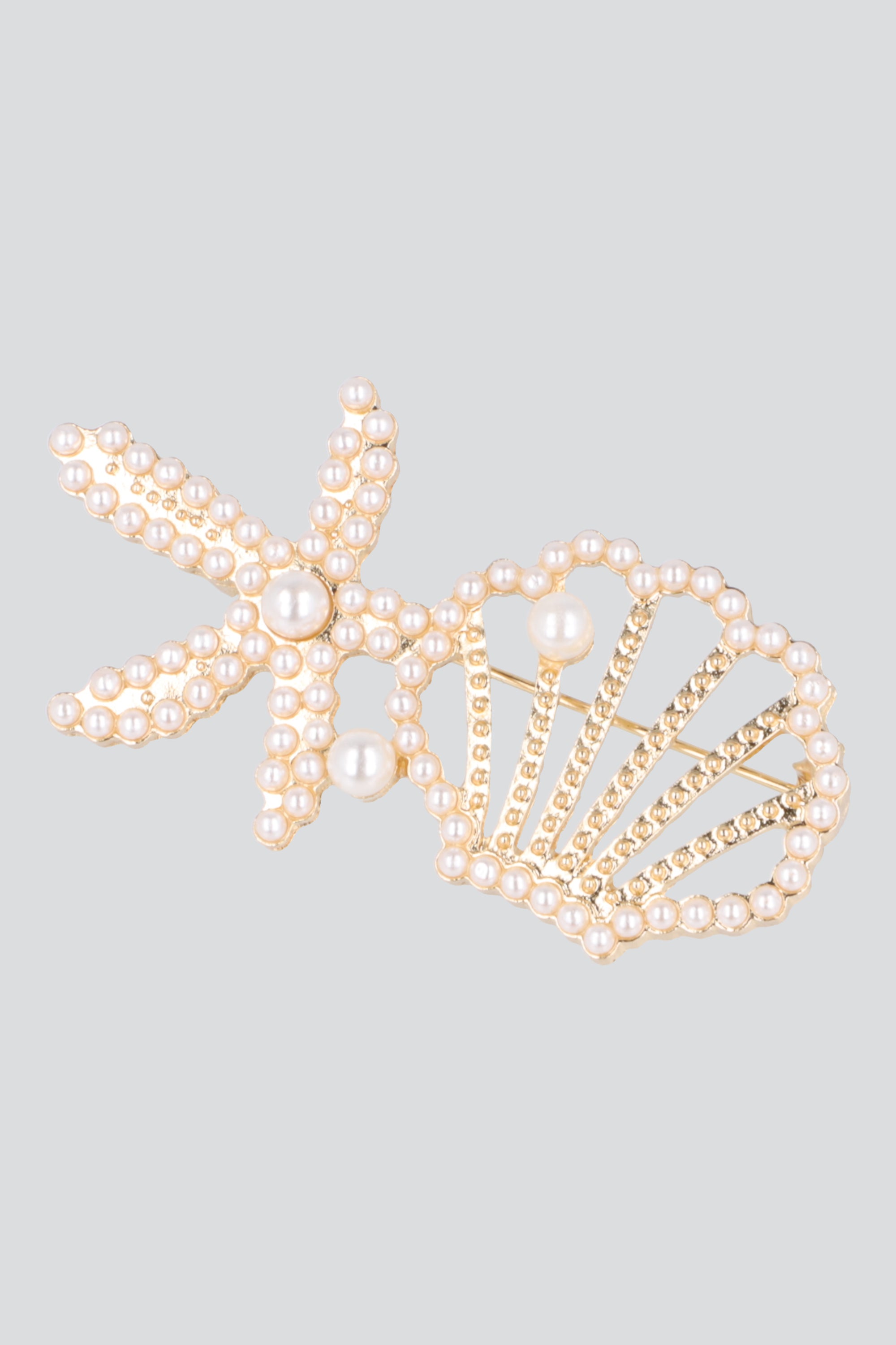 Broche estrella concha mar ORO