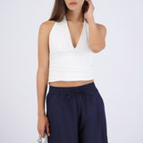 Top halter liso con pliegues