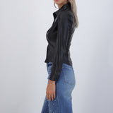 Blusa PU manga larga lisa