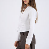 Camisa manga larga detalle cortes en cintura