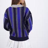 Suéter cuello polo detalle escudo