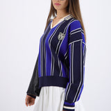 Suéter cuello polo detalle escudo