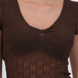 Top manga corta detalle transparencia textura