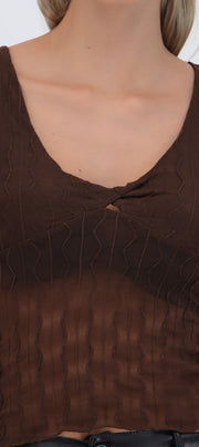 Top manga corta detalle transparencia textura