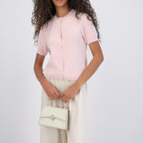 Top cuello redondo detalle botones