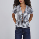 Blusa manga corta cuadros detalle moños