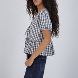 Blusa manga corta cuadros detalle moños