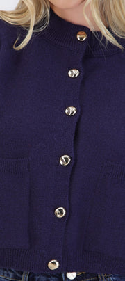 Cárdigan cuello alto detalle bolsas