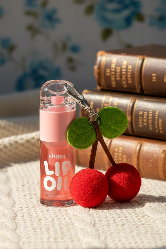 Lip oil charm cerezas pompon